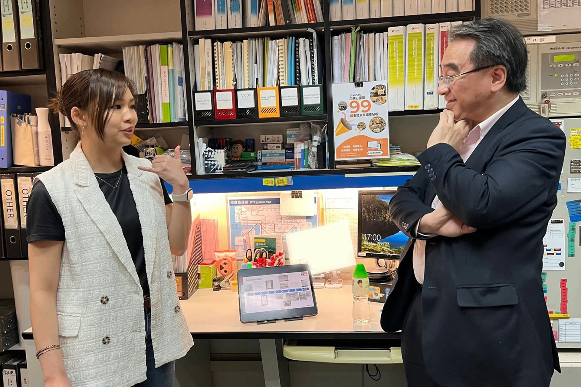Sharon consulting with a client in their office